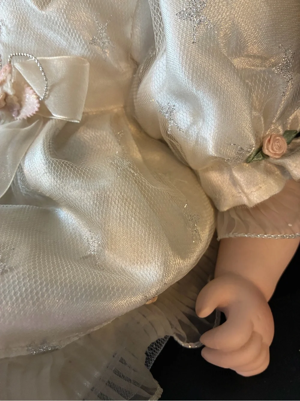Vintage porcelain doll holding wand and wearing halo